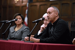 Father Shay Auerbach, who works with indigenous people in the Diocese of Richmond, talks about helping parishes in need. To his left are John Kevin Boland, bishop emeritus of the Diocese of Savannah, and Veronica Rayas, director of the Office of Religious Formation for the Diocese of El Paso. (Photo by Dana Maxson)