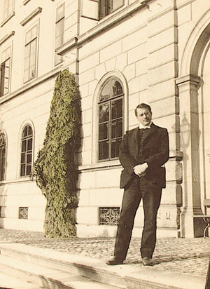 Carl Gustav Jung is pictured standing in front of a building in Burghölzi, Zurich, Switzerland.