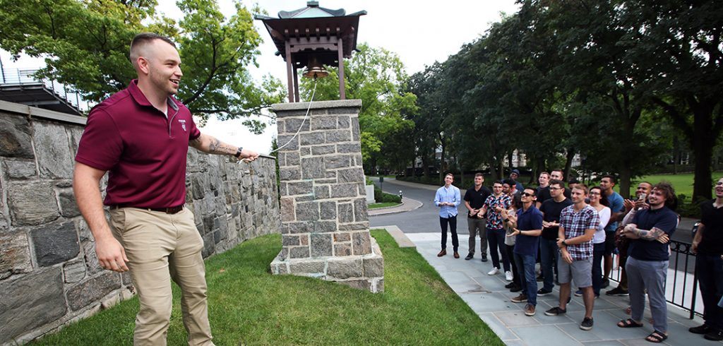 FVA President Wesley Wilson rings the victory bell, welcoming the new veterans to campus.