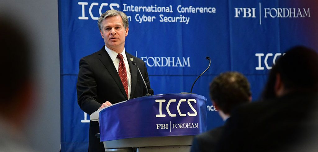 FBI director Chris Wray speaks at a podium