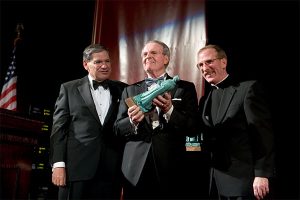 Osgood at the 2005 Founder’s Dinner with John Tognino, PCS '75, then chair of the Board of Trustees, and Joseph M. McShane, S.J., president emeritus of Fordham University.