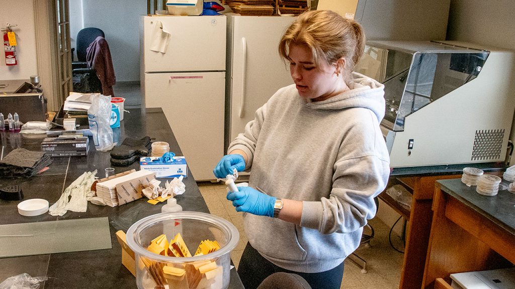 Tierney Kulju working with soil samples as part of her sustainable farming research