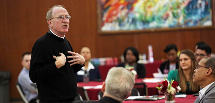 Father McShane delivering his welcome remarks at the conference