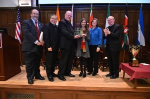 From left, Henry Schwalbenberg, director of the IPED program, Archbishop Bernadito Auza, Cardinal Timothy Dolan, Sarah Weber, Michelle Broemmelsiek, and Joseph M. McShane, SJ