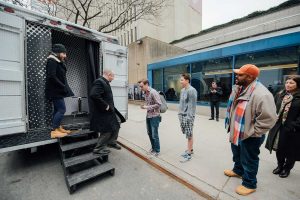 People wait to have their picture taken inside the Inside Out truck.