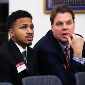 Brenton Petty and Coach Neubauer listen to the Gents. 