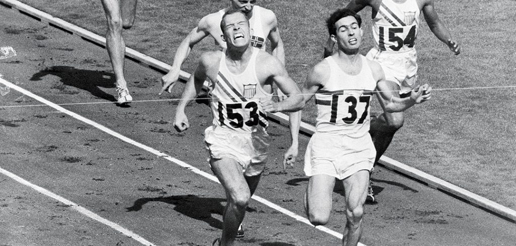 Fordham graduate Tom Courtney crosses the finish line, winning the gold medal in the 800-meter race at the 1956 Olympics.