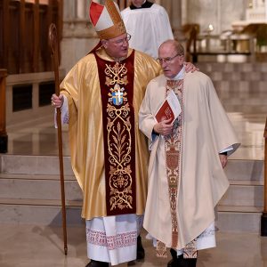 Cardinal Dolan and Father McShane on the altar at St. Patrick's. 