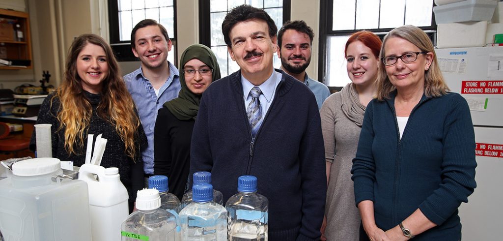 Berish Rubin, Sylvia Anderson and Fordham students pose for a picture in Dr. Rubin's biology lab.