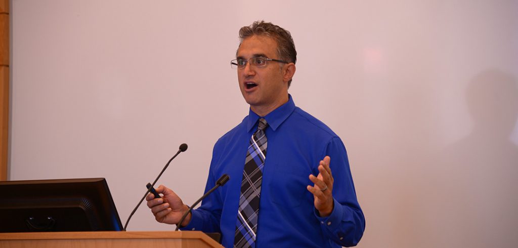 Political professor Nicholas Tampio standing at a podium at Fordham Law School