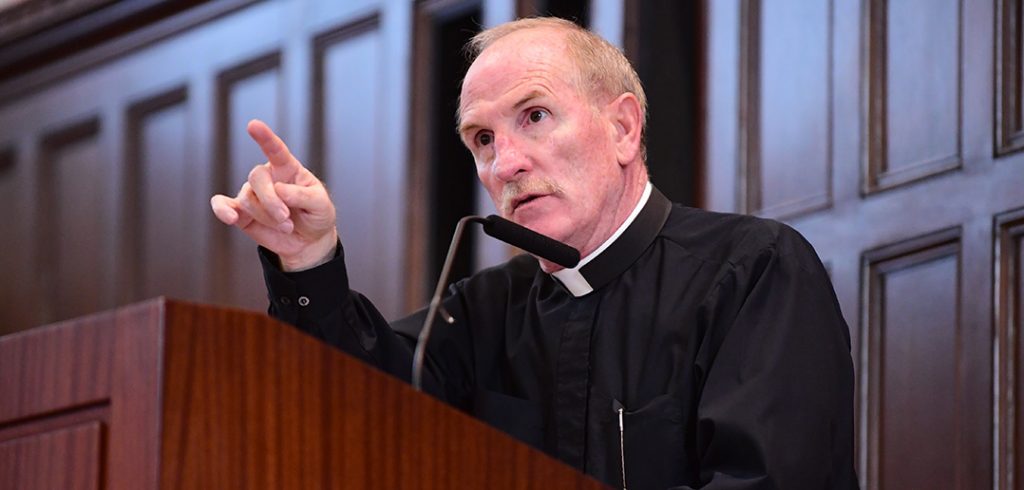 Joseph M. McShane, S.J., addresses faculty and staff in Keating First auditorium