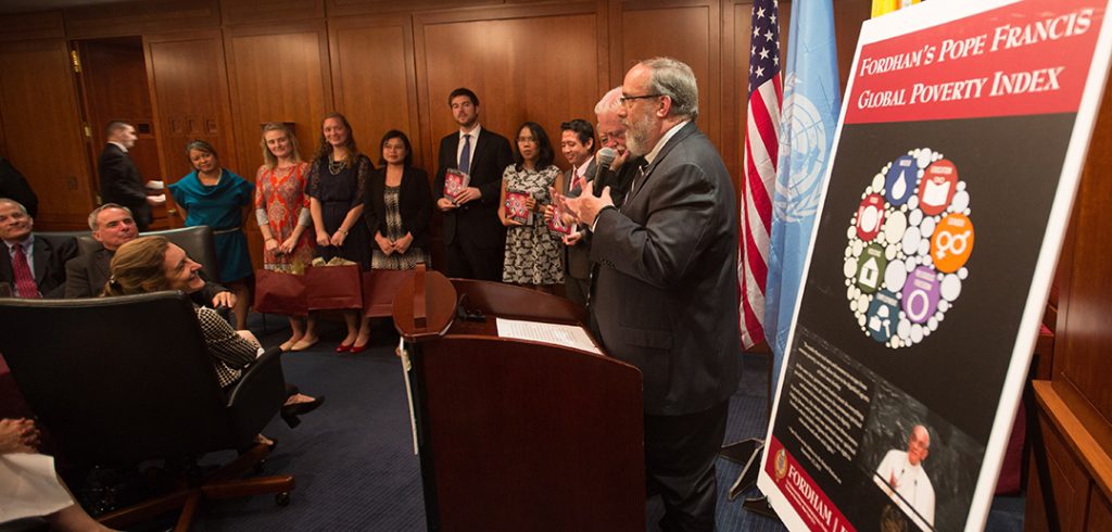 Students present Global Poverty Index to Archbishop Gallagher.