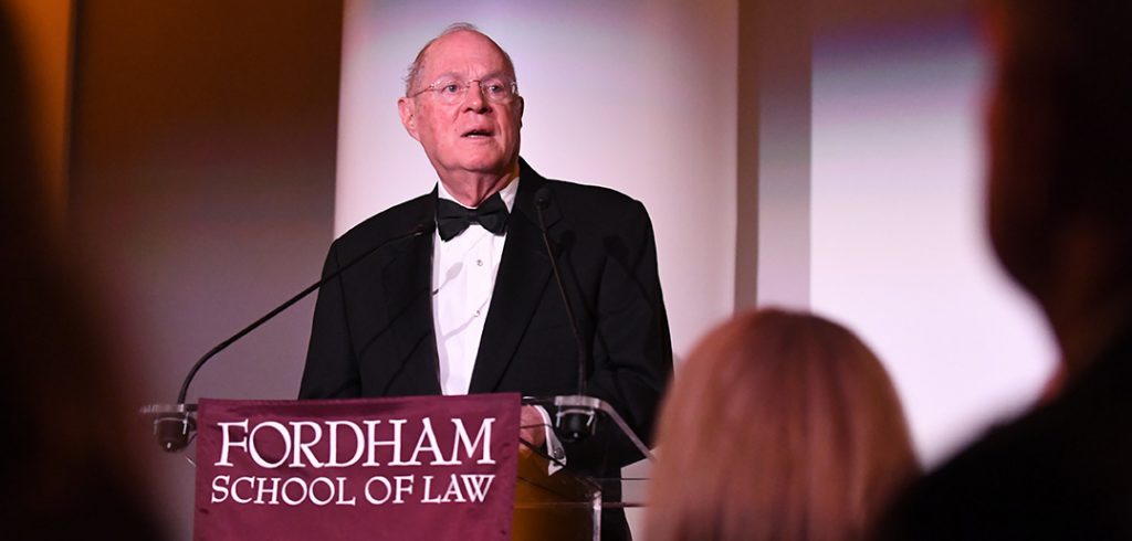 Supreme Court Justice Anthony Kennedy speaks from a podium at Fordham's School of Law