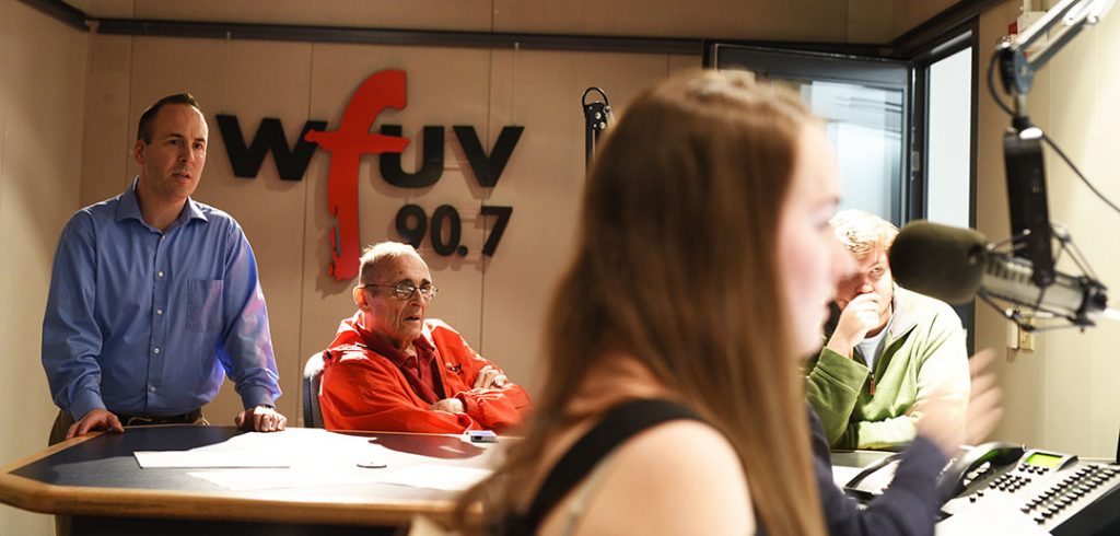 WFUV sports director Rick Schultz (left) and former sports director Bob Ahrens (seated) with members of the sports team on Saturday, Nov. 4, during the station's broadcast of Fordham football's game against Holy Cross.