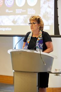 Ambassador Geraldine Byrne Nason, Permanent Representative of Ireland to the United Nations, delivering remarks from a podium at the Lincoln Center campus.