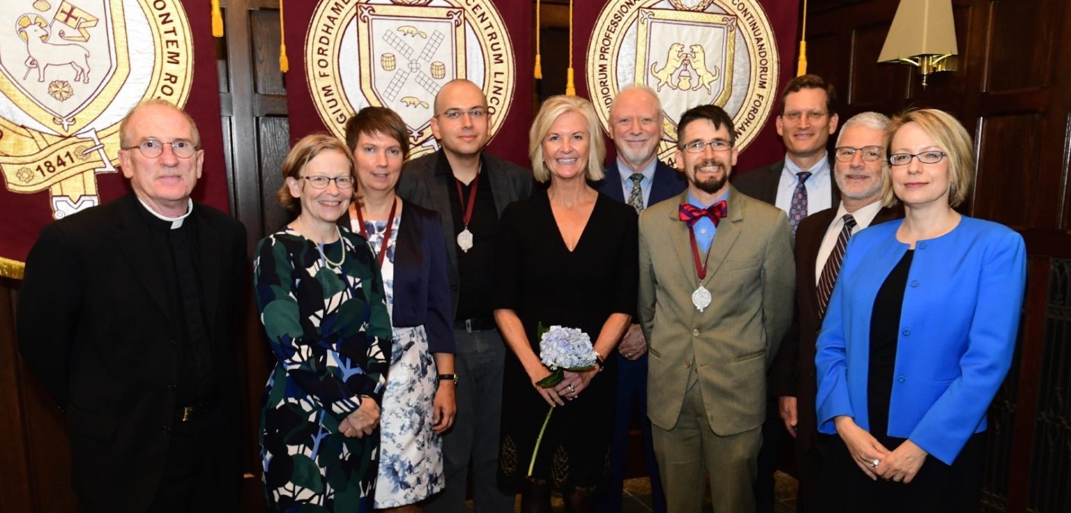 The three new Bepler STEM faculty chairs standing with Kim Bepler, Father McShane, Fordham deans, and administration