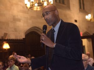 Mark L. Chapman, associate professor and associate chair in the African and African American Studies department stands up and praises Copeland for her lecture.