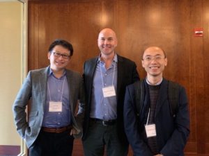 Zhu Xu, from Eastern China Normal University in Shanghai, Stephen Grimm, and Weiping Zheng stand together and pose for a picture.