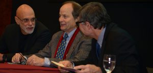 Mitchell Stephens, Rick Moulton, and Ron Simon sit at a table in hte 12th floor lounge.