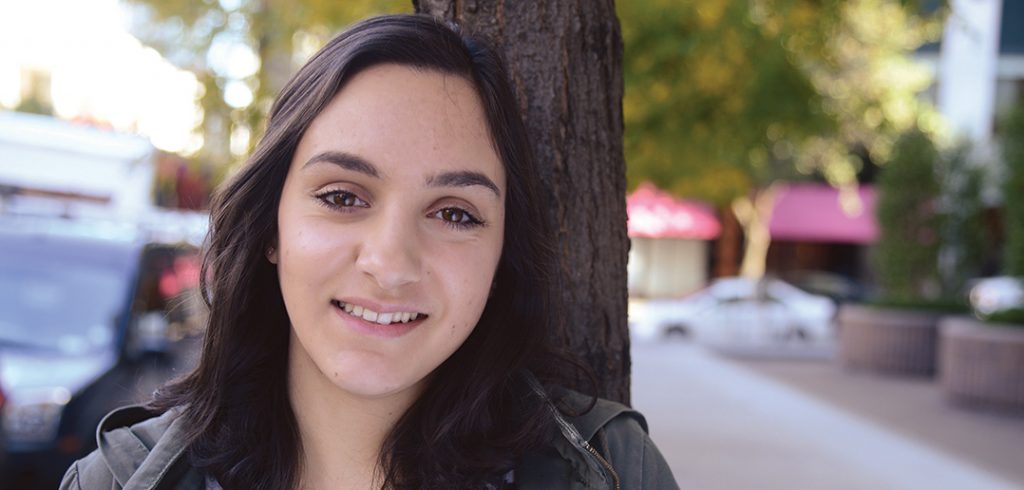 Rachel Ragone standing in front of a tree.