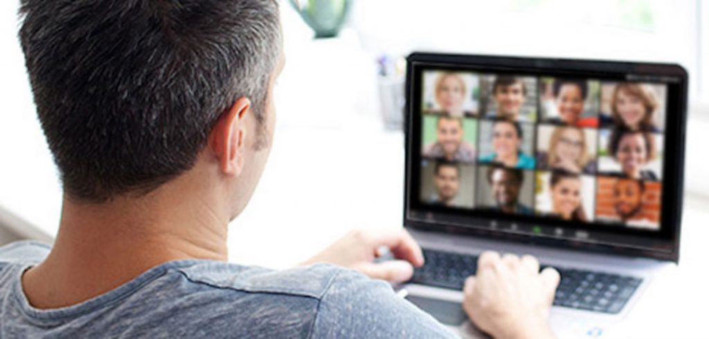 man sitting at computer