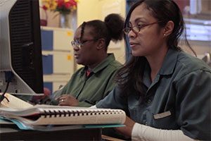 Students in the Bedford Hills College Program at work in the College Learning Center, which has a computer lab, library, and an area for students to meet with professors