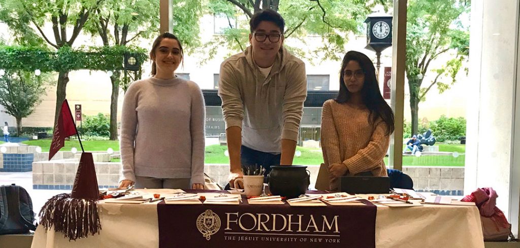 students at a table in FCLC lobby