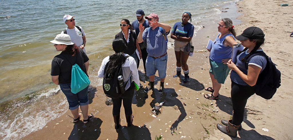 Botton with students on Plum Beach