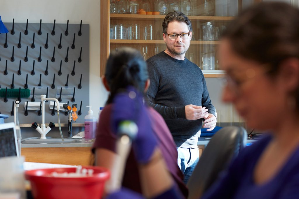 Jason Munshi-South, associate professor of biological sciences in his classroom