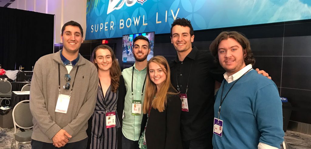 Students pose at Radio Row