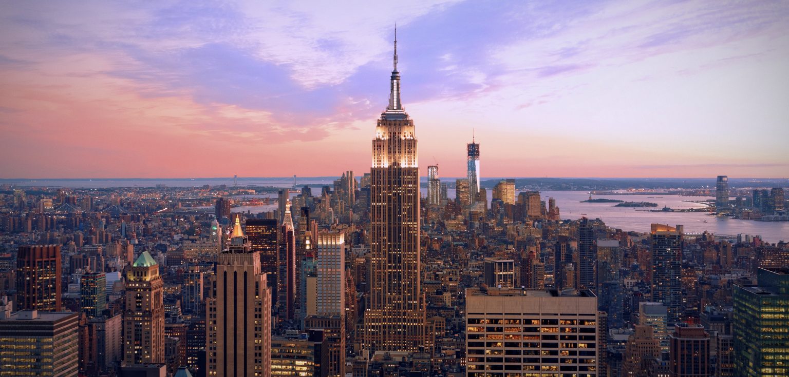 An aerial view of the NYC skyline at sunset or sunrise