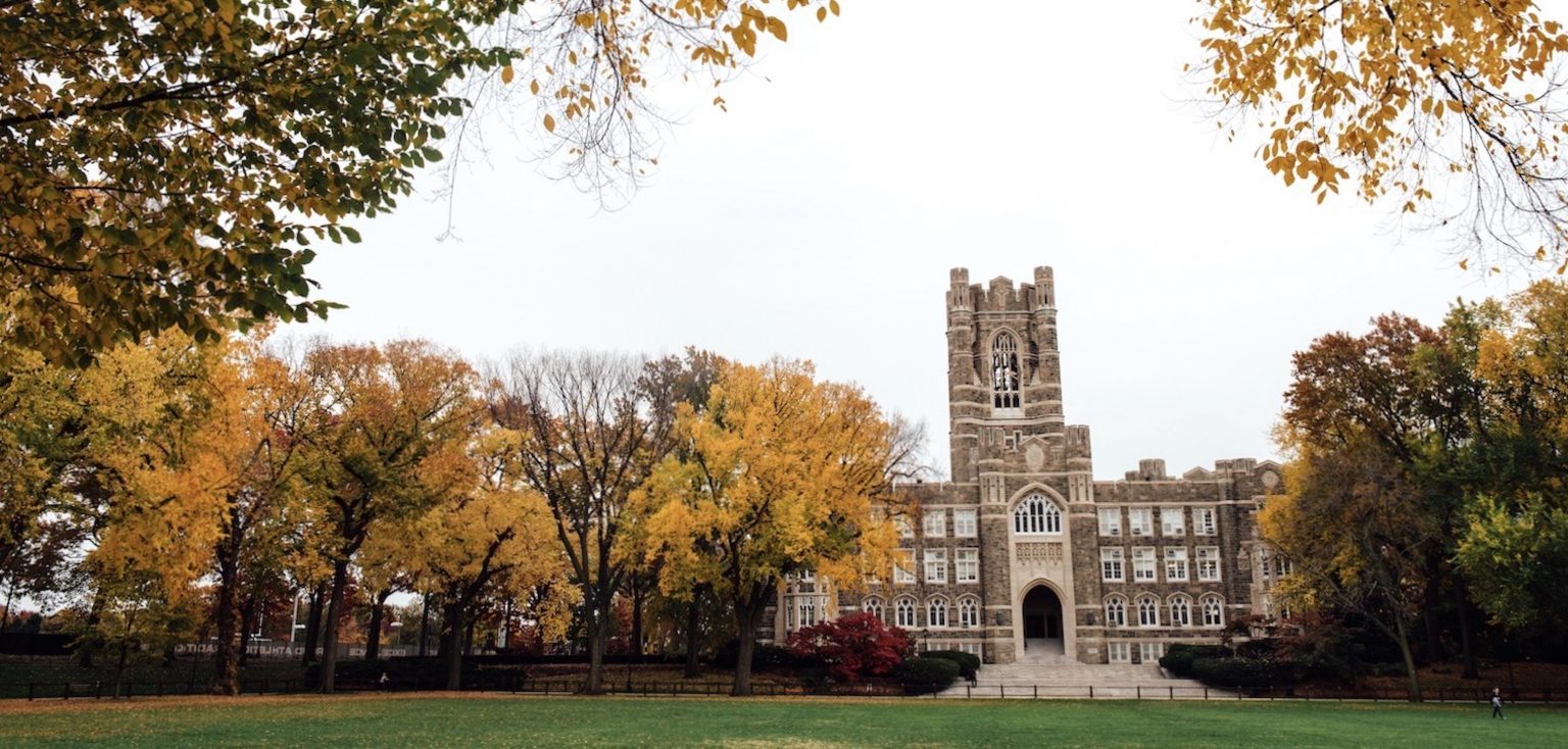 A Gothic-style building surrounded by autumn trees