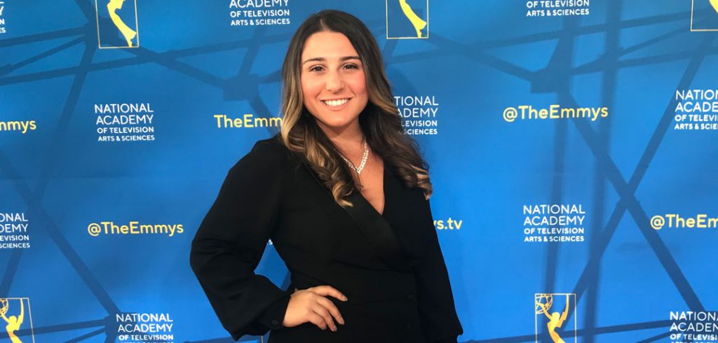 A girl poses for a picture after winning an award