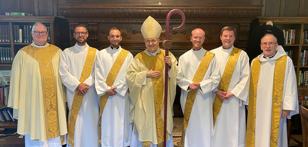 Joseph O’Keefe, SJ, Zachariah Presutti, SJ, Michael Lamanna, SJ, Bishop James Massa, Daniel Gustafson, SJ, William Woody, SJ, and Joseph M. McShane, SJ