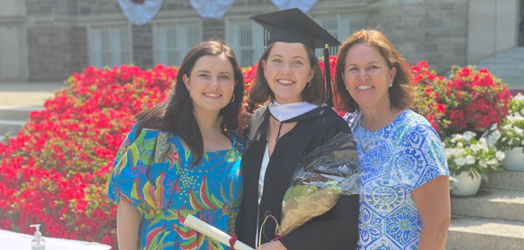 Three women pose for a photo