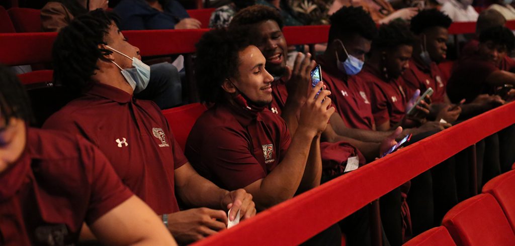 Team members settle into their seats before the show. (Photo by Bruce Gilbert)