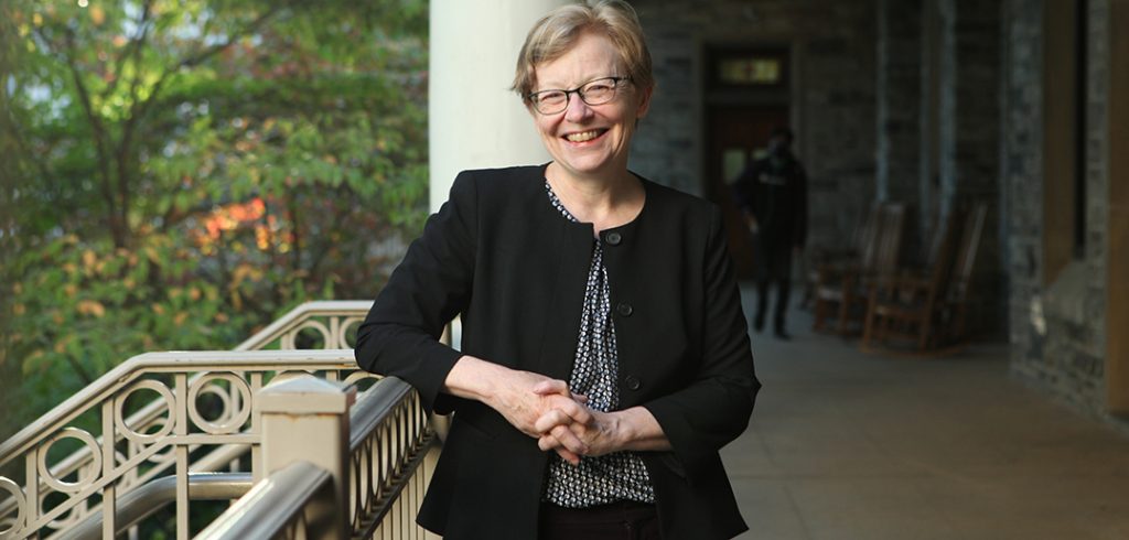 Maura Mast on the porch of Loyola Hall, home of the Manresa learning community 