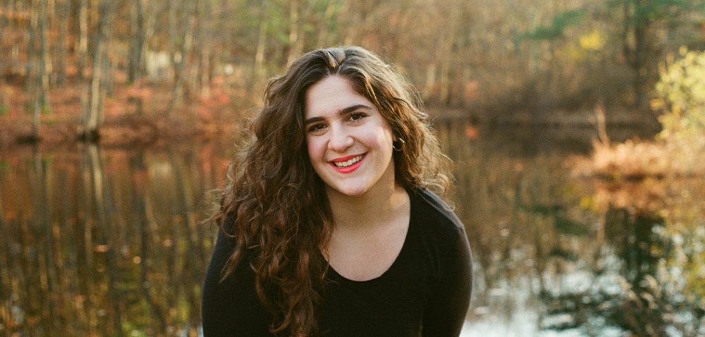 Olivia Greenspan in front of a pond.