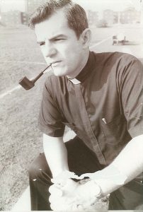 Monsignor Shelley smoking a pipe