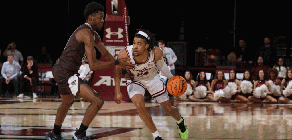 basketball players on court with ball