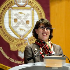 Laura Aurrichio speaking from a podium 