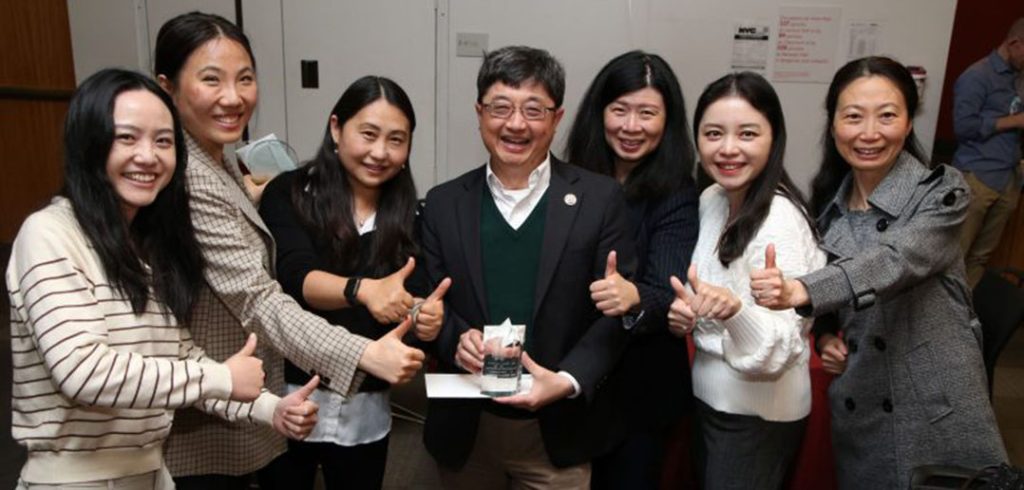 Dean’s Award for Overall Excellence award winner, Robert Chiang, Ph.D., celebrating with faculty members.