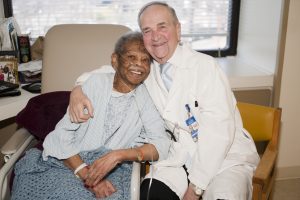 Dr. Brescia with a patient at Calvary Hospital