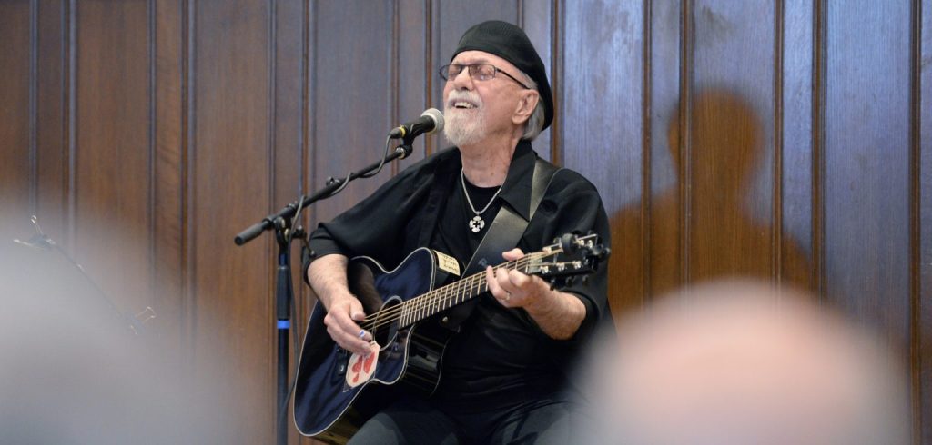 Dion sings and plays the guitar.