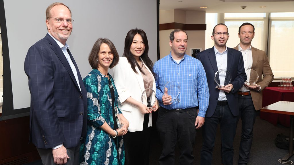 From left: Dennis Jacobs, provost of the University, with Kirsten Swinth, Jie Ren, Christopher Koenigsmann, Mohamed Rahouti, and Marc Conte. Photos by Bruce Gilbert