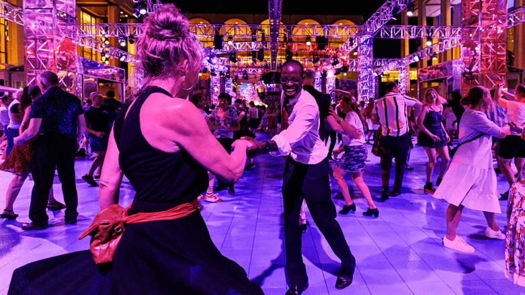 Man and woman dancing at Lincoln Center.