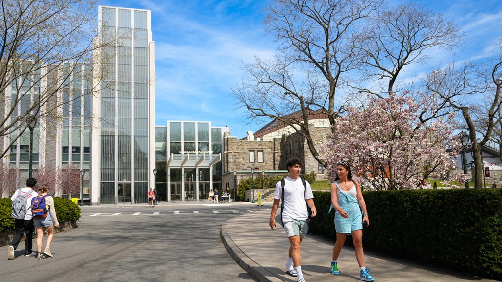 Students walking in front of the Joseph M. McShane, S.J. Campus Center at the Rose Hill campus