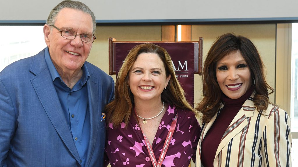 Fordham President Tetlow poses with retired four-star general, Jack Keane, and Angela McGlowan.