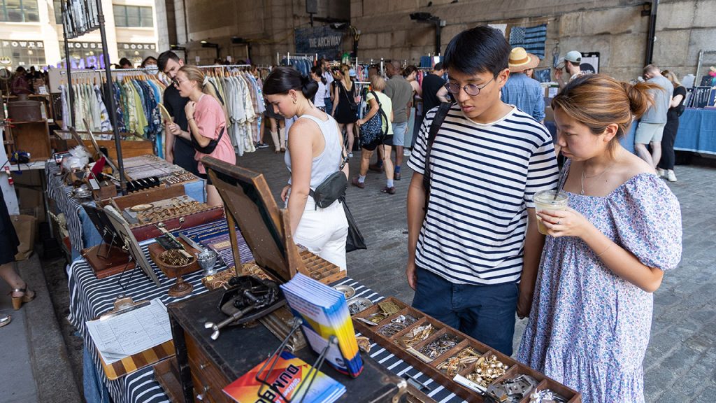 People looking at products at the Brooklyn flea