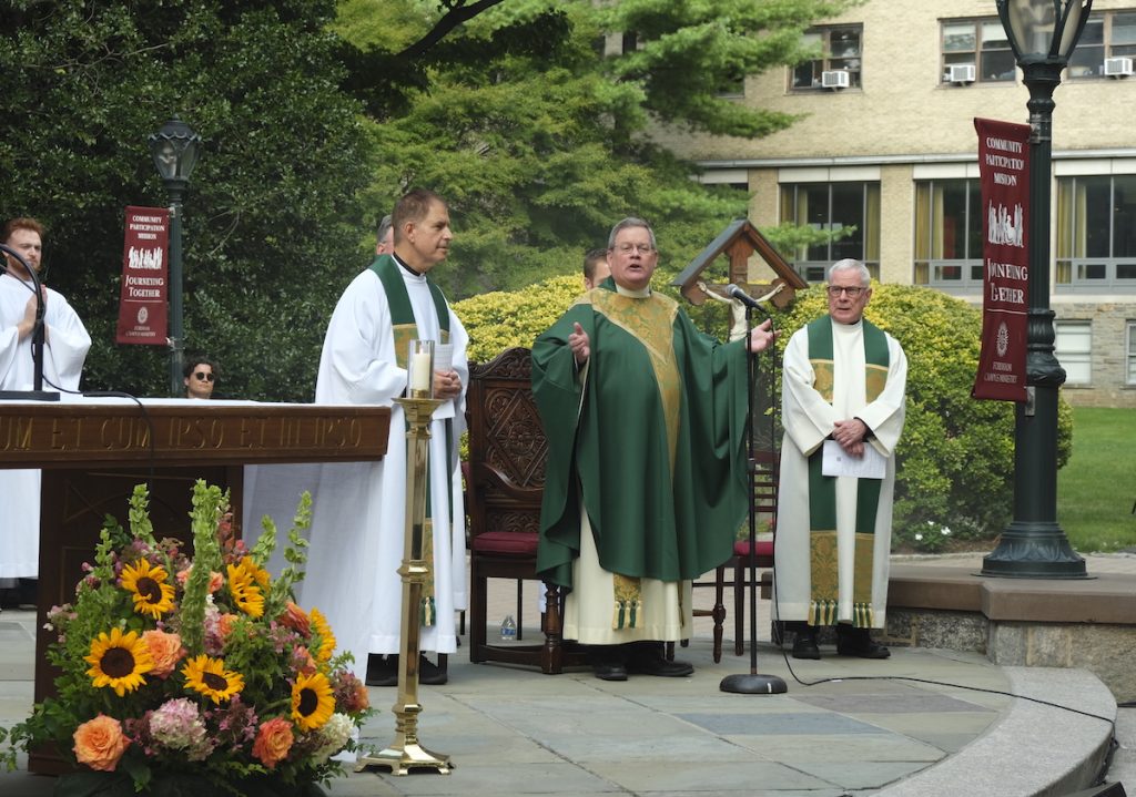 Father Phil standing outside of Fordham's University Church. He is leading the new student mass at Rose Hill at the end of move-in day. Photo by Eli Taylor
